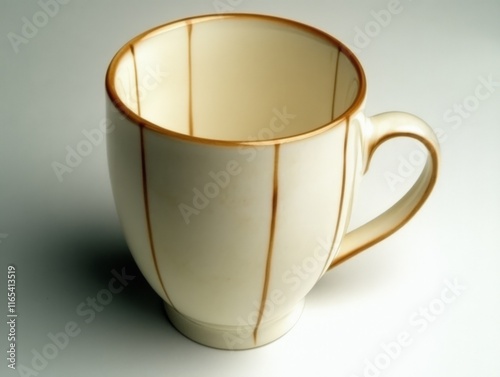 A simple ceramic mug with a smooth surface and decorative lines, ideal for beverages. photo