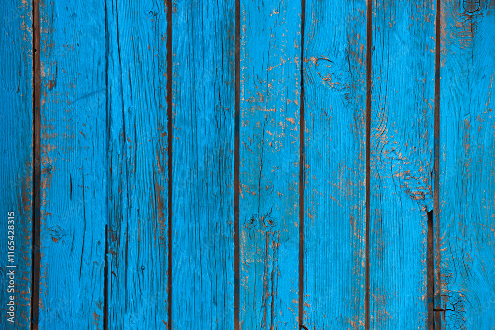 Old wooden planks standing upright with a shabby blue paint all over the field image for use as a background or wallpaper Old wooden planks standing upright with a shabby blue paint all over the field image for use as a background or wallpaper