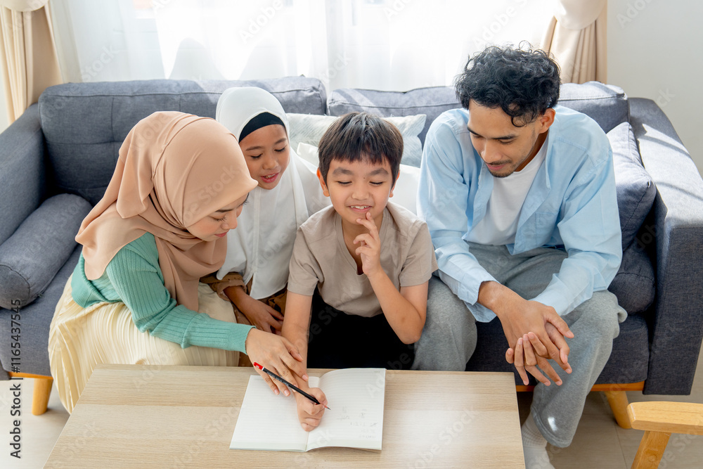 Asian little boy express thinking action during write puzzle game for playing with his older sister and joy with the family at home. Asian little boy express thinking action during write puzzle game for playing with his older sister and joy with the family at home.