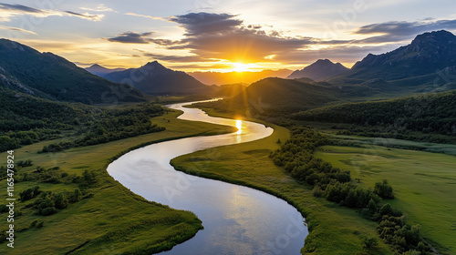 Breathtaking sunset over winding river surrounded by mountains and greenery
