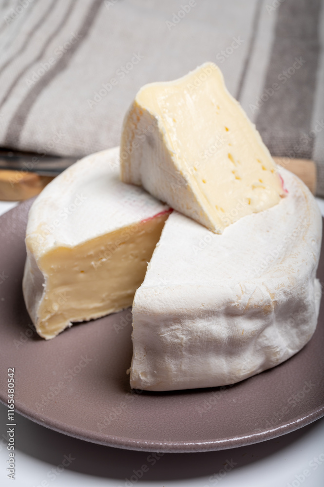Cheese collection, French reblochon de savoie gratin cow milk cheese close up Cheese collection, French reblochon de savoie gratin cow milk cheese close up