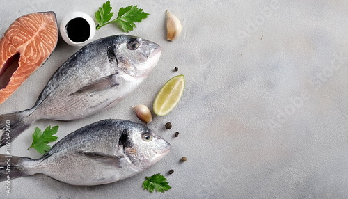 Fresh Gilthead Bream Fish Preparation with Herbs, Lemons, and Garlic photo