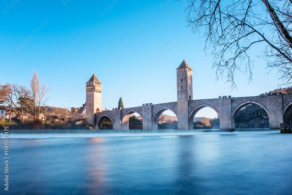 Naklejka premium The 14th and 15th century Valentré bridge, a UNESCO World Heritage Site, crossing the River Lot in the town of Cahors in France