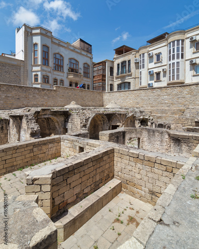 Panoramic view of the remnants of the Shirvanshahs Palace bathhouse in Baku, Azerbaijan. The stone structure stands as a testament to the grandeur and functionality of a once-thriving building photo