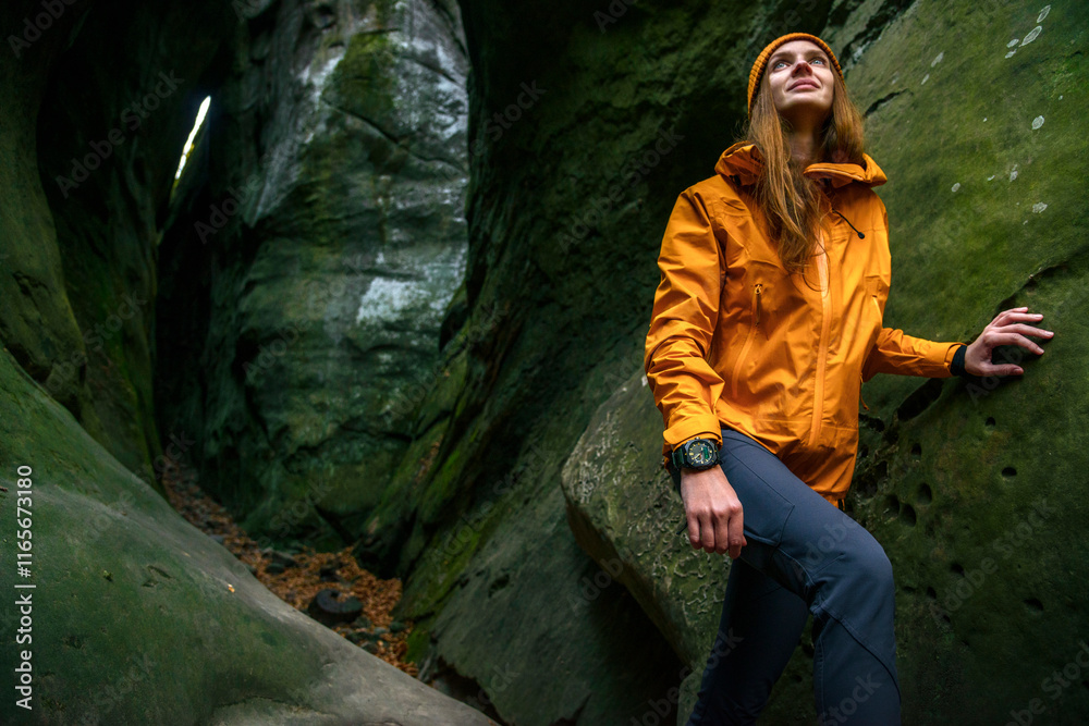 Female Traveler Exploring a Cave in a Canyon with Focus on Her Hand and Travel Watch Female Traveler Exploring a Cave in a Canyon with Focus on Her Hand and Travel Watch