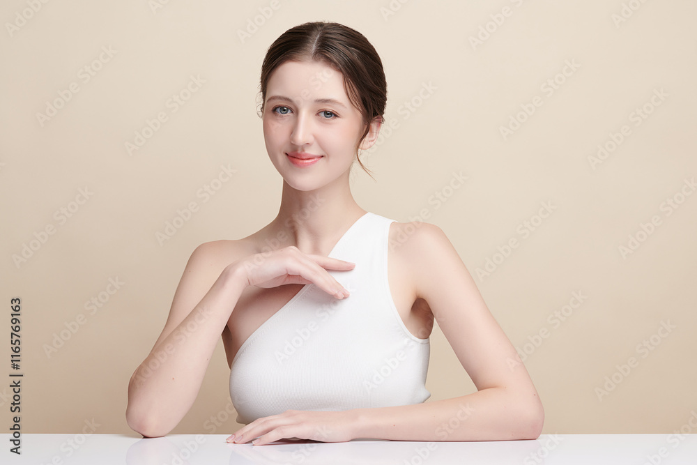 Beautiful young woman with clean fresh skin on beige background, Face care, Facial treatment, Cosmetology, beauty and spa, women portrait. Beautiful young woman with clean fresh skin on beige background, Face care, Facial treatment, Cosmetology, beauty and spa, women portrait.