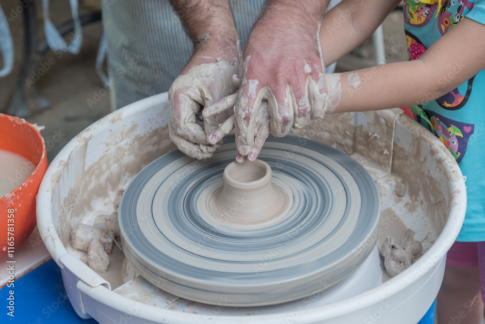 Fototapeta premium The master teaches young people clay art.