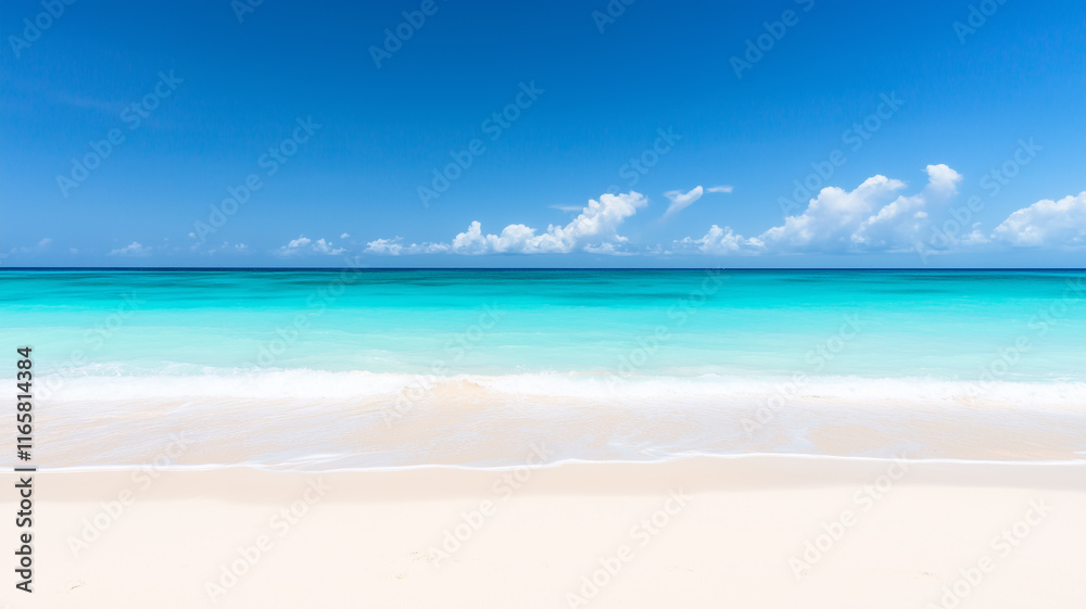 Tropical beach and turquoise sea with tide coming in as waves gently roll onto white sand Tropical beach and turquoise sea with tide coming in as waves gently roll onto white sand