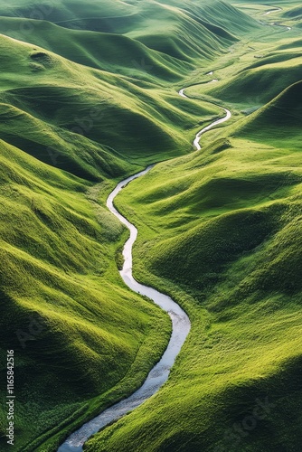 Flowing river winds through lush green hills in a tranquil landscape