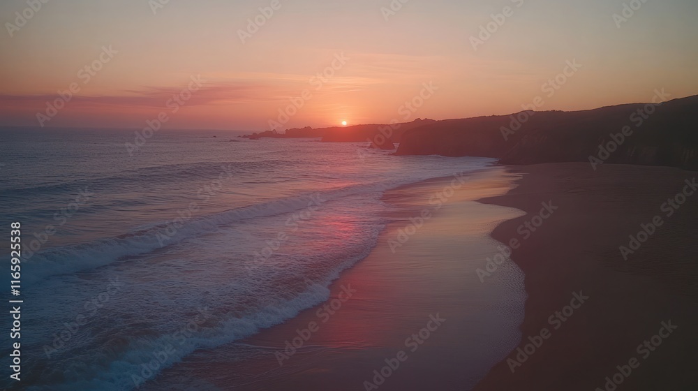 Fototapeta premium Coastal sunset, waves on sandy beach.