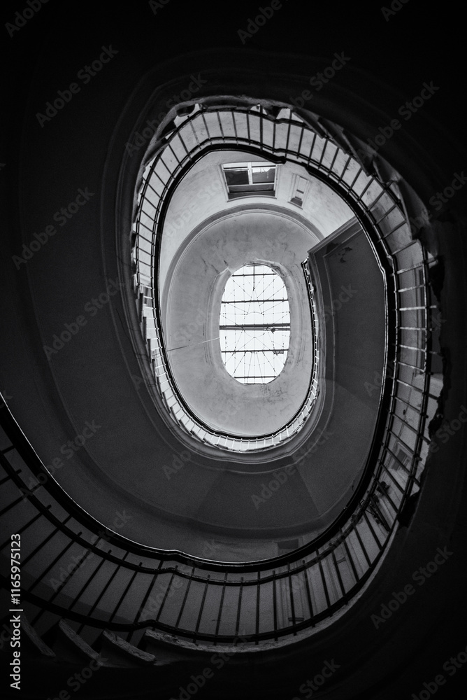 Fototapeta premium Ancient circular staircase indoors. 2018