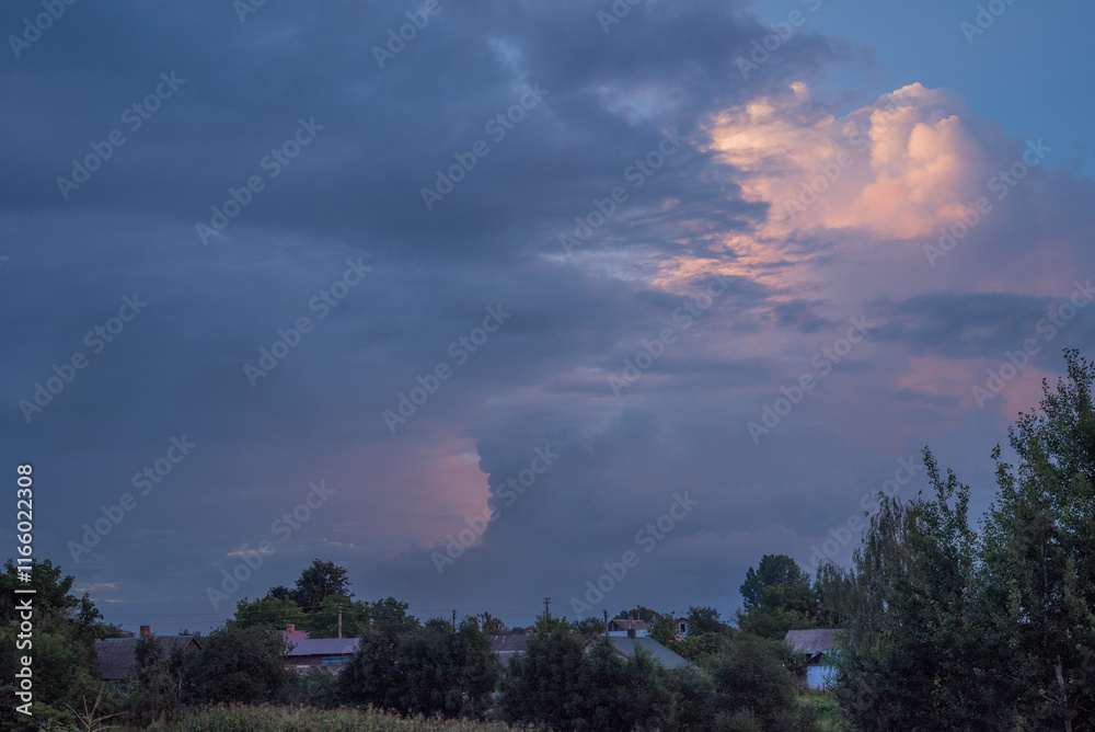 Obraz premium storm clouds over the sky in the village of Tuchyn