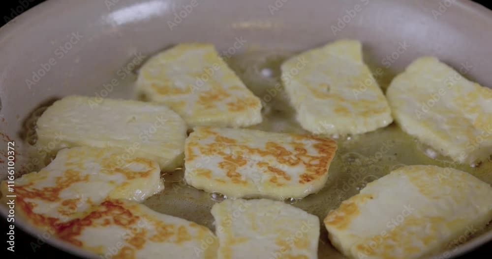 A pan of cheese is cooking on a on a frying pan with butter. A pan of cheese is cooking on a on a frying pan with butter.