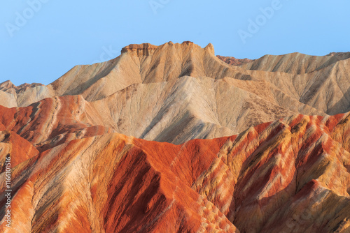 Under the clear sky, the colorful Danxia landforms