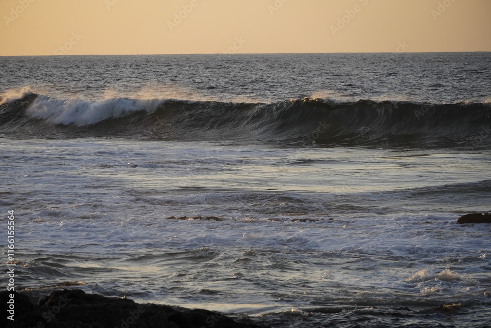 Autumn afternoon watching the sunset and waves from the cliff Autumn afternoon watching the sunset and waves from the cliff