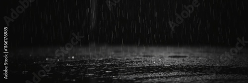 classic black and white wet rainy scene.  Dark  timeless elegant style depict drizzling rain on reflective surfaces and background texture photo