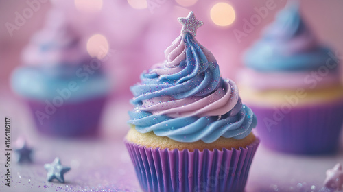 cupcakes with blue and pink cream decorated with a star and sequins photo