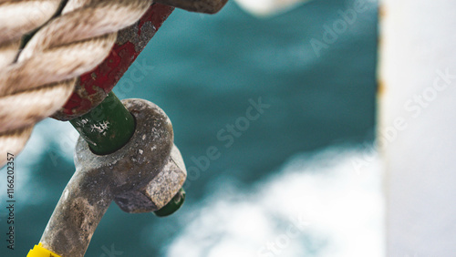 Heavy duty bolts shackle on a boat ship rusty marine equipment strong  photo