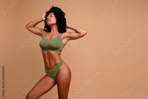 Studio no retouch photo of stunning sensual lady dressed lingerie loving body positive empty space isolated ivory color background