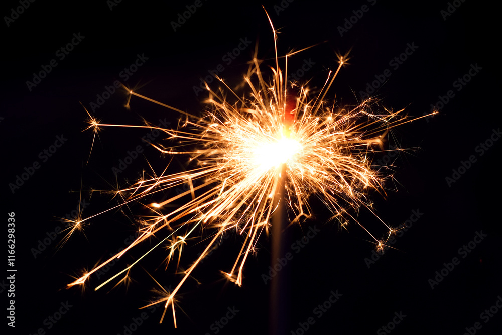 Close up of burning handheld sparkler as background Close up of burning handheld sparkler as background