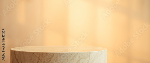 light beige cylindrical pedestal on a warm beige background