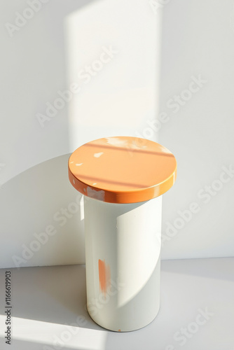 small cylindrical pedestal with a light- top