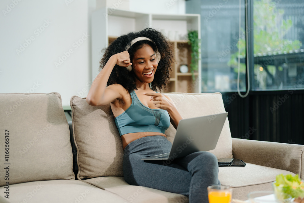 A fit woman enjoys a fresh salad with fruits and juice, embodying wellness, nutrition, and vitality i A fit woman enjoys a fresh salad with fruits and juice, embodying wellness, nutrition, and vitality i