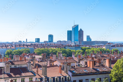 Modern skyscrapers rise in the downtown district over the residential buildings of Lyon, France