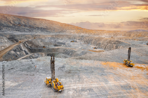 Drilling machine borer installing cast explosives blasting. Banner industry Open coal mine photo