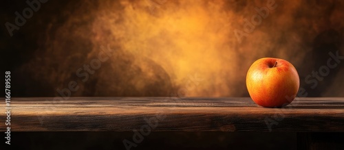 Rustic wooden table featuring an apple with a warm blurred background ideal for product displays or culinary presentations photo