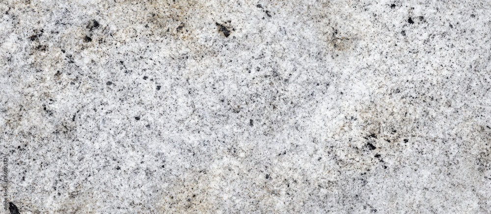 Granite stone wall texture with a grainy appearance ideal for historical and architectural themes in design projects. Granite stone wall texture with a grainy appearance ideal for historical and architectural themes in design projects.