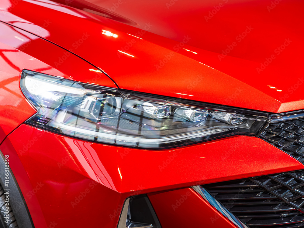 Close up of the car detailing: beauty clean headlights of red SUV Close up of the car detailing: beauty clean headlights of red SUV