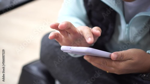 businessman using mobile phone,Touching gadget choose app. ASEAN tourists Using smartphone check flight schedule information while waiting to check in at airport terminal for travel relax