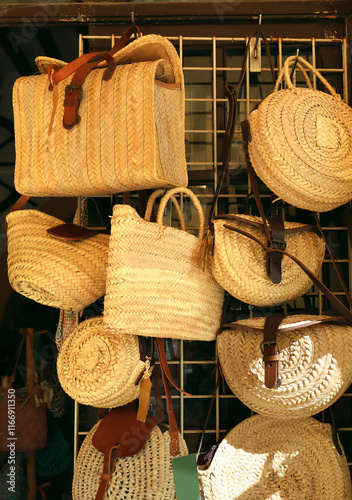 Obraz na płótnie Straw hand bags for sale at showcase in Palma, Mallorca, Spain w salonie