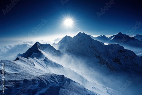 The majestic mountains of China. The sun shines through the fog on top of many layers of mountain peaks, forming light spots like diamonds in the sky. Aerial photography perspective, high angle overhe photo