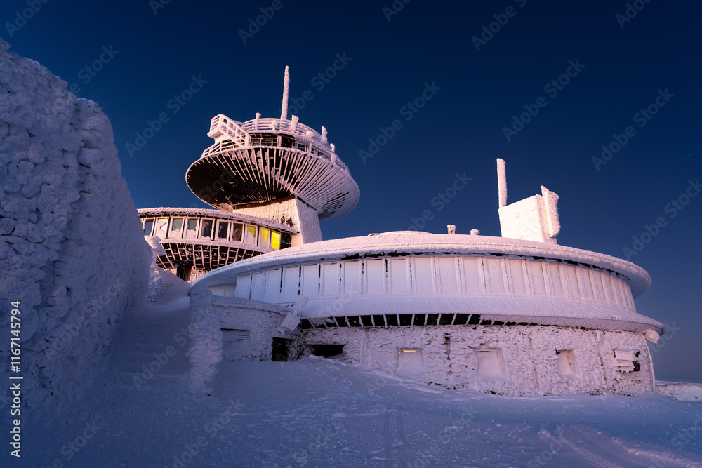 building of meteorological observatory on Snezka summit at dawn in Krkonose mountains in Poland