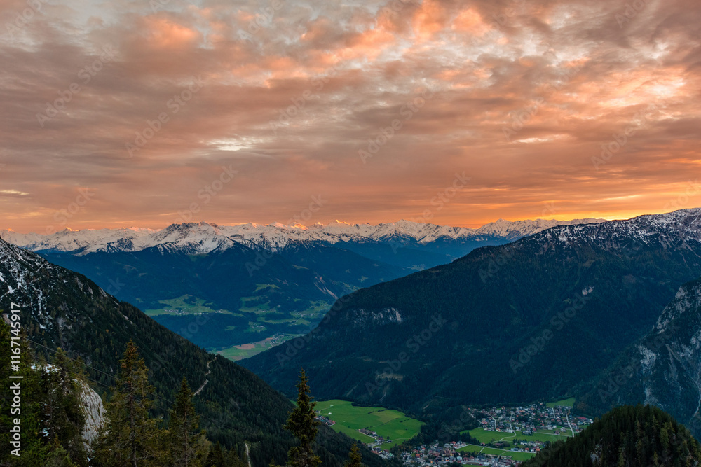 Fototapeta premium Fiery Sunset Over Maurach: Mountain Panorama