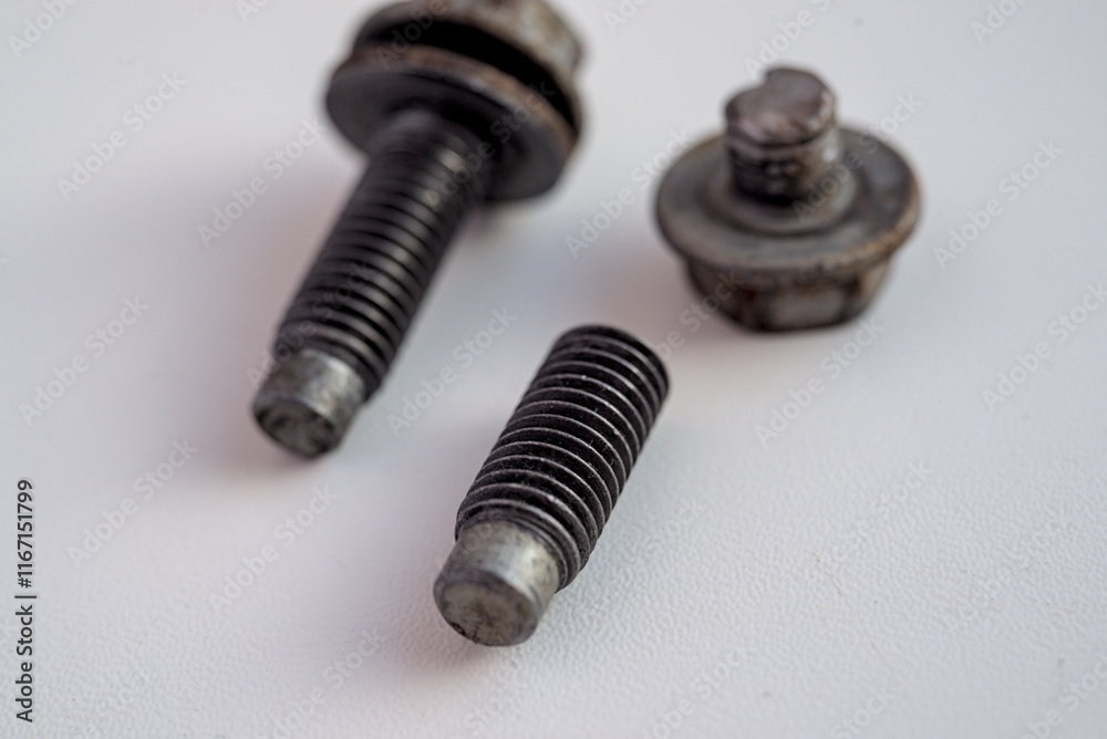 Broken and solid bolts on white background