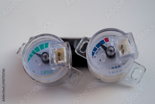 Photo of two gas level sensors on white background