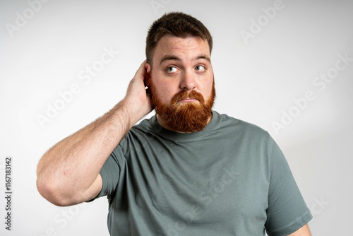Foto Young man with doubt expression, confused and wonder concept, uncertain future isolated over grey background