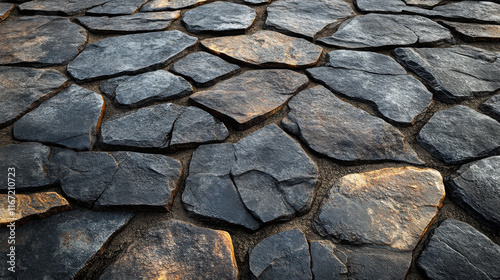 A flagstone pattern with dark grey pieces of stone and a beige sandy thin grout, photorealistic, hyperrealistic. photo