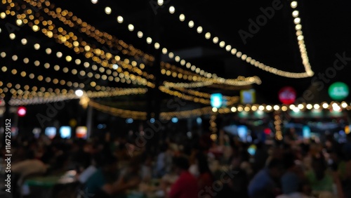 Bokeh lights at night for festivals and people shopping and partying at city night market.