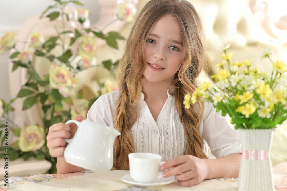 Smiling little girl holding big cup of tea Smiling little girl holding big cup of tea