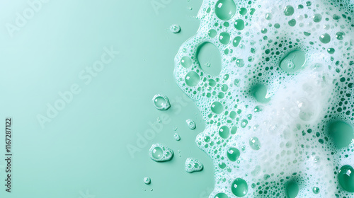 White foam cream texture, soap bubble or cosmetic gel clean foam isolated on mint background with copy space