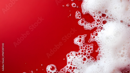 White foam cream texture, soap bubble or cosmetic gel clean foam isolated on red background with copy space