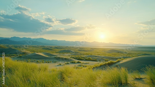 Desert dunes at sunset with mountains, lake, and cloudy sky.