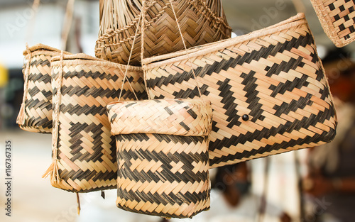 Some indigenous baskets from the Brazilian Amazon, made with palm straw, with a geometric pattern, decorated with natural dye from the Genipa americana plant, known in Brazil as Genipapeiro
