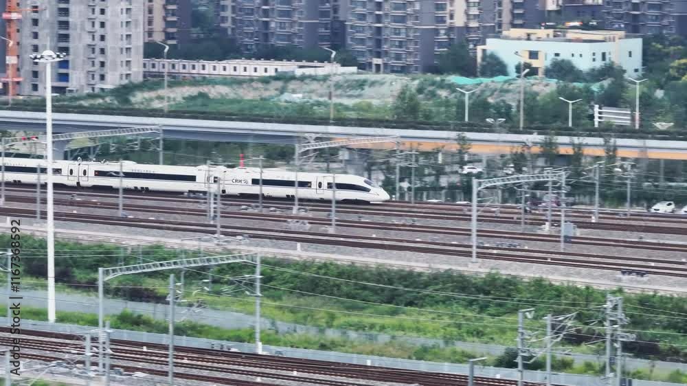 High-speed trains at a busy station in an urban area during the day showcasing modern transportation infrastructure High-speed trains at a busy station in an urban area during the day showcasing modern transportation infrastructure