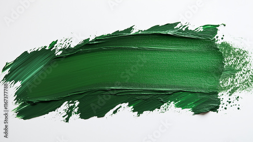 A vibrant green paint stroke spreads across a white canvas, illustrating its thick texture and smooth application, ideal for art projects and demonstrations. photo