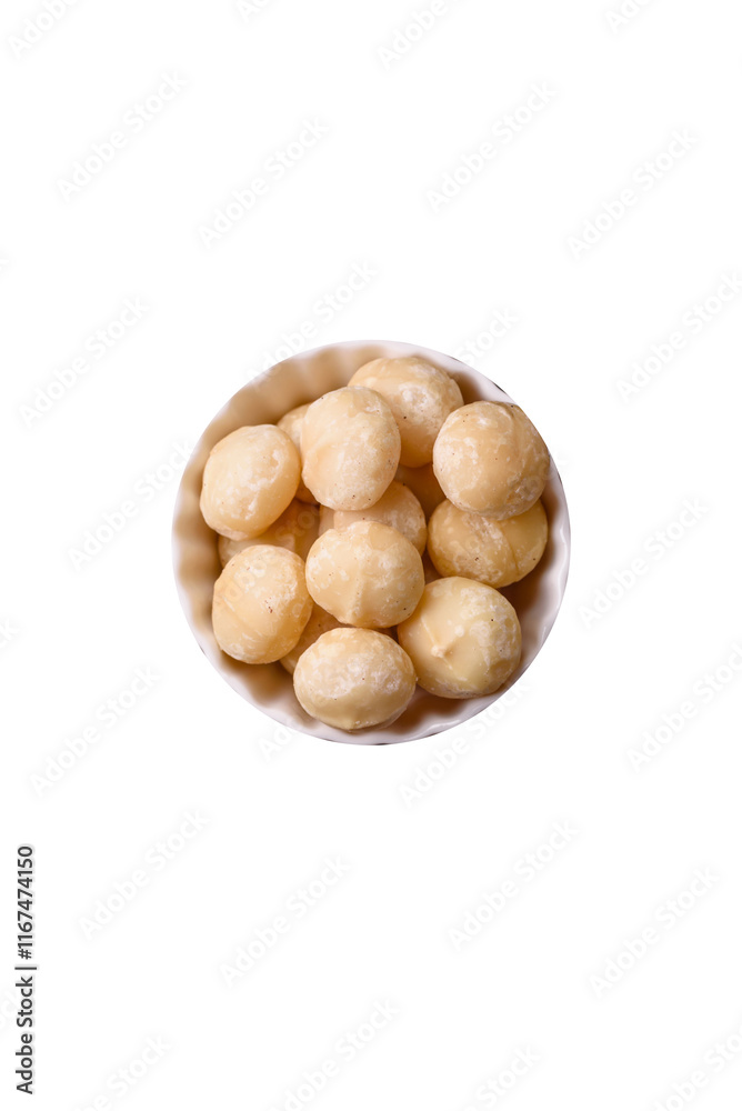 Delicious nutritious macadamia nuts in ceramic bowl Delicious nutritious macadamia nuts in ceramic bowl